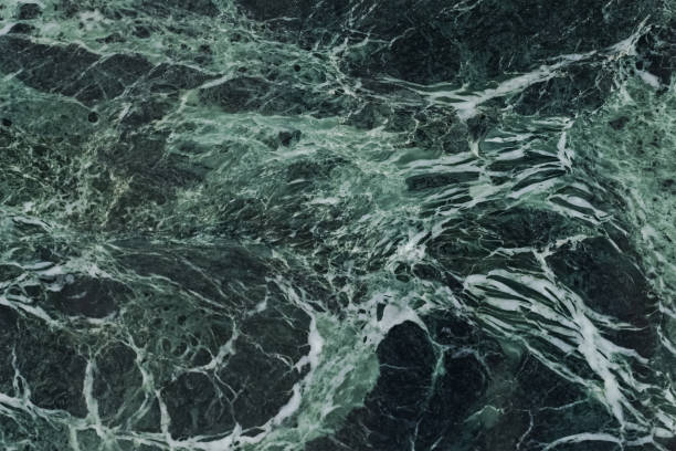 istock The dark green marble. Facing stone. Texture 1286100416
