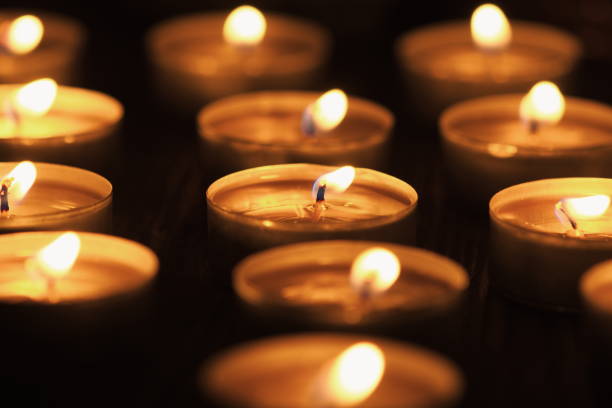 istock Many burning candles with shallow depth of field 1286104090