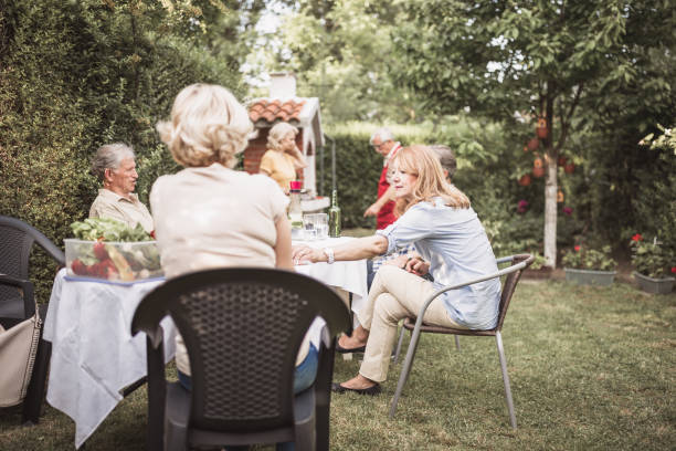 istock Senior people, friends, enjoying backyard barbecue 1286104242
