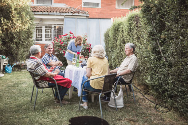 istock Senior people, friends, enjoying backyard barbecue 1286104462