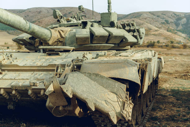 istock Russian battle tanks at tankodrome in mountains 1286107023