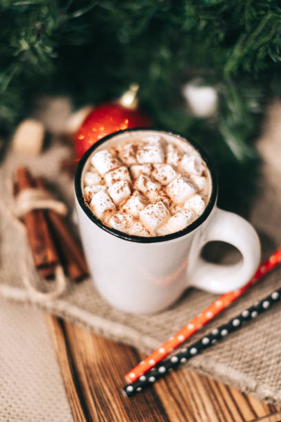 istock Hot cocoa with marshmallows on wooden board. 1286115635
