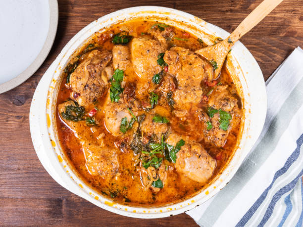 istock Ready Italian dish - Tuscan chicken with sun-dried tomatoes, tomato paste, spinach, cream and cheese in a frying pan. 1286116107