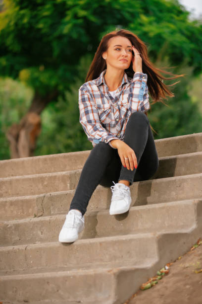 istock Woman sitting on the steps 1286118868