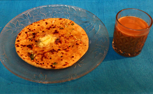 istock Gobi paratha with butter and tea 1286119048