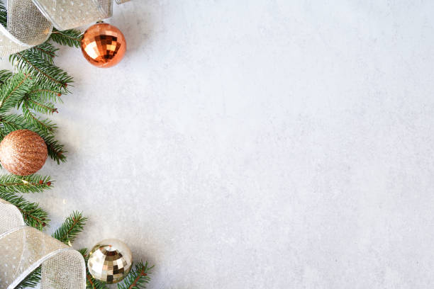 istock christmas background - decorations and fir branch on white table, copy space 1286120114