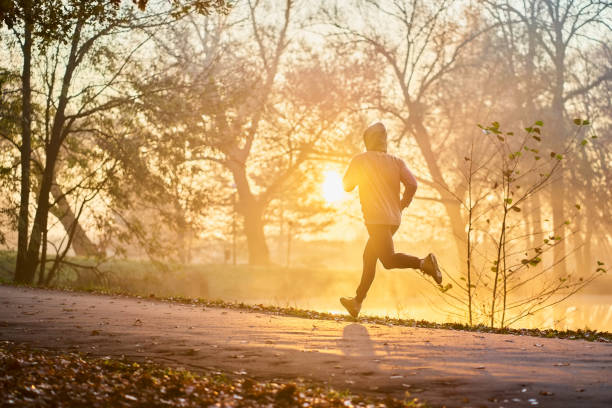 istock Autumn run in the park 1286120284