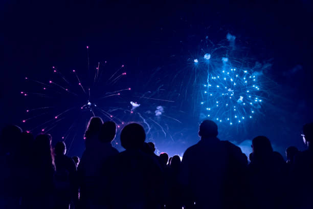 istock Crowd watching fireworks and celebrating new year eve 1286120516