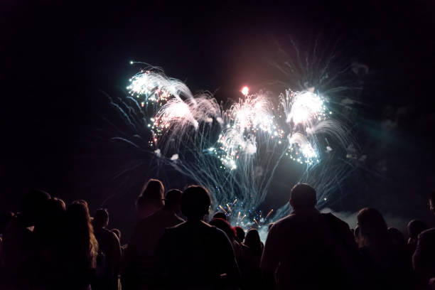 istock Crowd watching fireworks and celebrating new year eve 1286120550