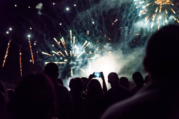 istock Crowd watching fireworks and celebrating new year eve 1286120575