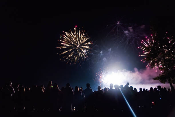 istock Crowd watching fireworks and celebrating new year eve 1286120586