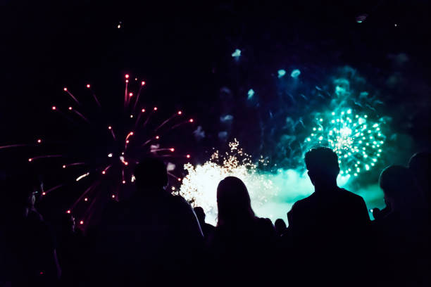 istock Crowd watching fireworks and celebrating new year 1286120598