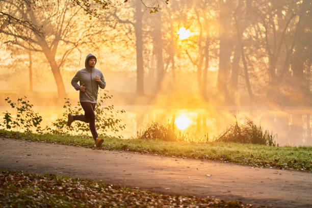 istock Runner in the park during autumn fall sunny morning 1286120690