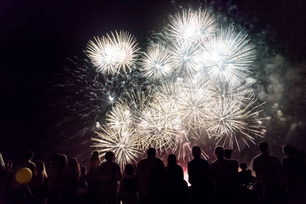 istock Crowd watching fireworks and celebrating new year eve 1286120720
