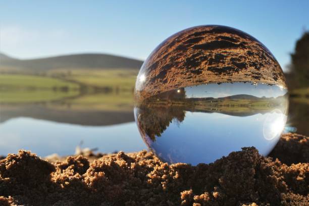 istock Glass ball and mist drifting across water 1286121792