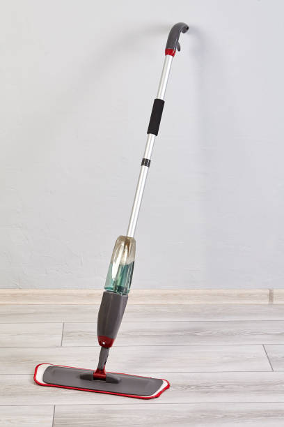 istock Flat mop with spray stands in house for cleaning floor. 1286123268