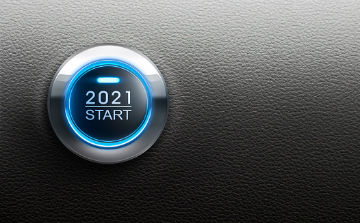 Blue illuminated start 2021 metal button on black leather backgound