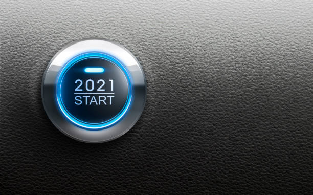Blue illuminated start 2021 button on black leather Blue illuminated start 2021 metal button on black leather backgound ignition photos stock pictures, royalty-free photos & images