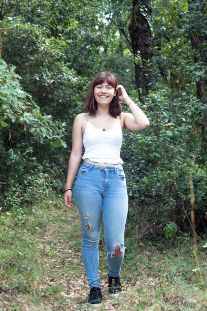 istock Cheerful girl walking in the forest 1286124049