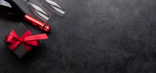 istock Valentines or Christmas card with champagne and gift 1286124063