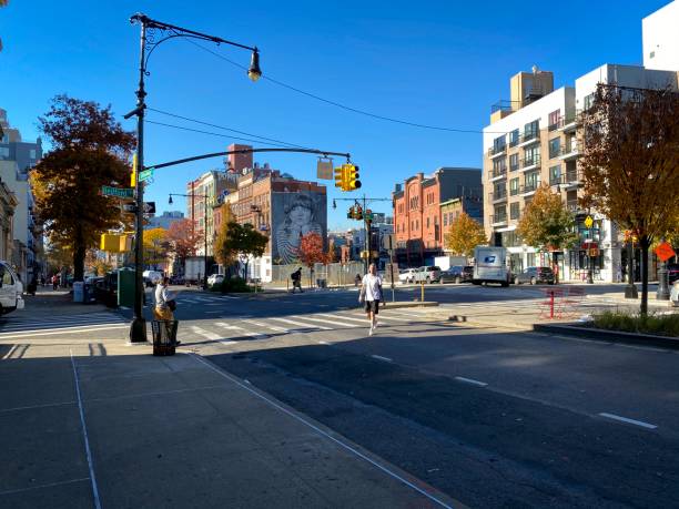 Bedford and Broadway intersection in Brooklyn Brooklyn, NY, USA - Nov 17, 2020: An expanded view at the intersection of two Brooklyn Straeets with wall art and buildings on a sunny day during the pandemic warren street brooklyn stock pictures, royalty-free photos & images