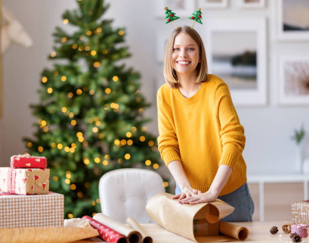 istock Friendly female packing Christmas gifts 1286126828