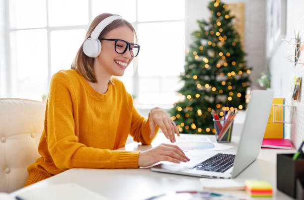 Cheerful freelancer making video call on Christmas day