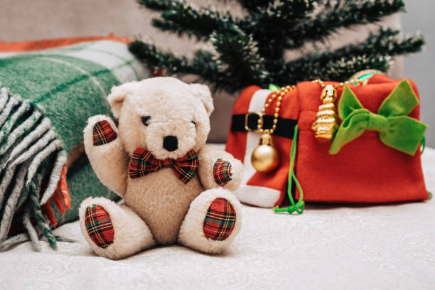 istock teddy bear and christmas decorations, checkered red green plaid 1286127882