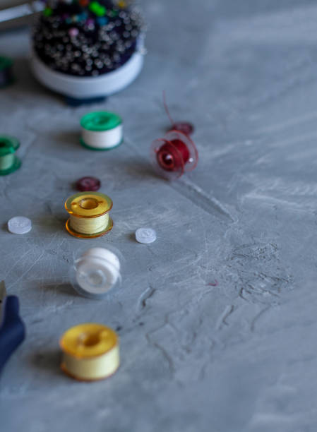 istock A sempstress inventory: buttons, needles, threads and scissors. 1286128262