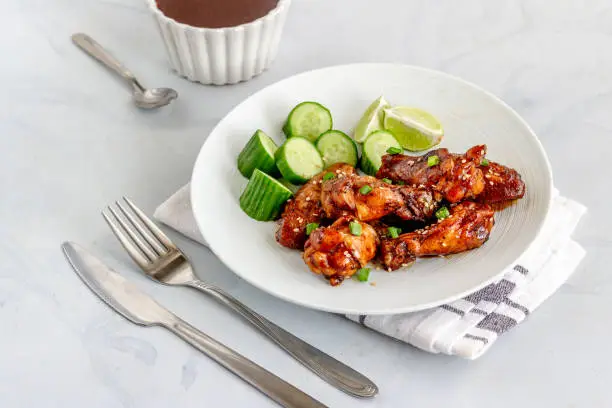 Barbecue Thai Chicken Wings with Lemon, Cucumber and Condiment