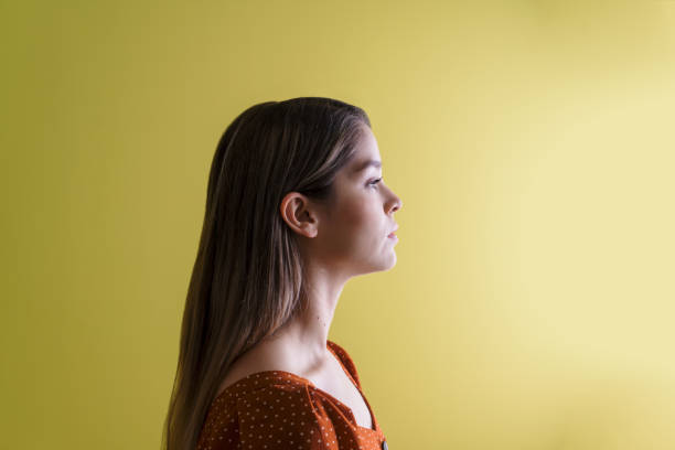 istock Sideview of young woman looking ahead 1286129473