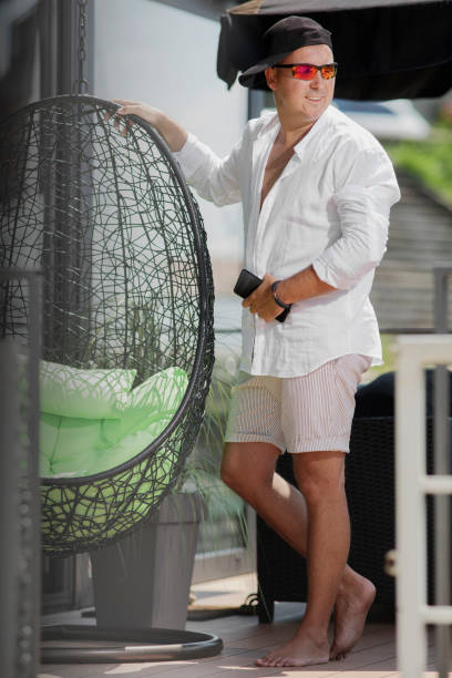 istock A man  standing on a rocking basket on a summer day 1286130039