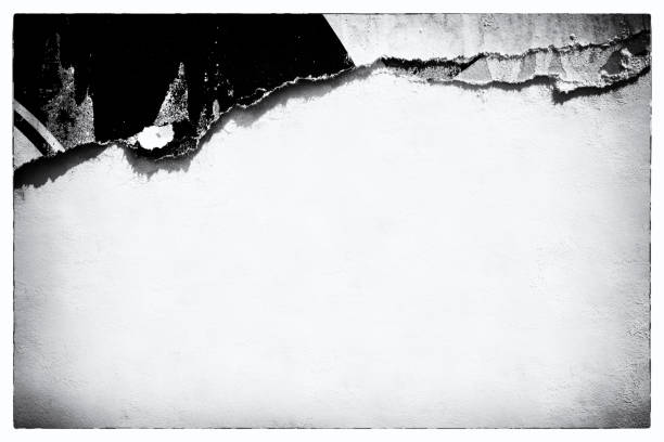 istock Old ripped torn paper crumpled creased posters grunge textures backdrop surface backgrounds placard Black and White 1286132256