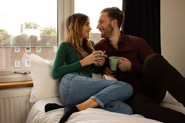 istock Young couple by the window 1286132584