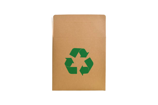 istock Green recycle symbol on box paper cardboard isolated on white background. 1286133155