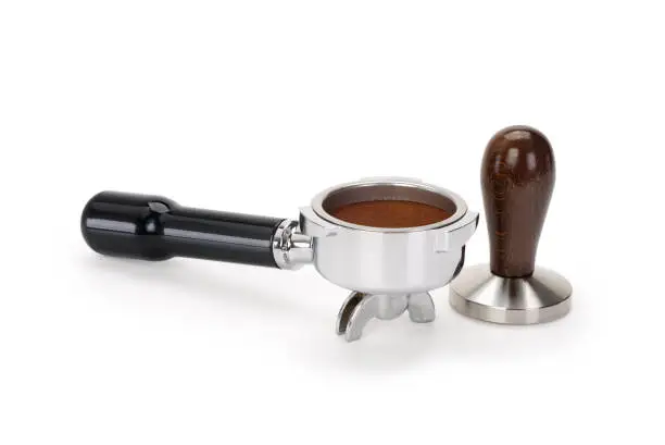 Espresso coffee machine piston and tamper isolated on white background. Contains clipping path.