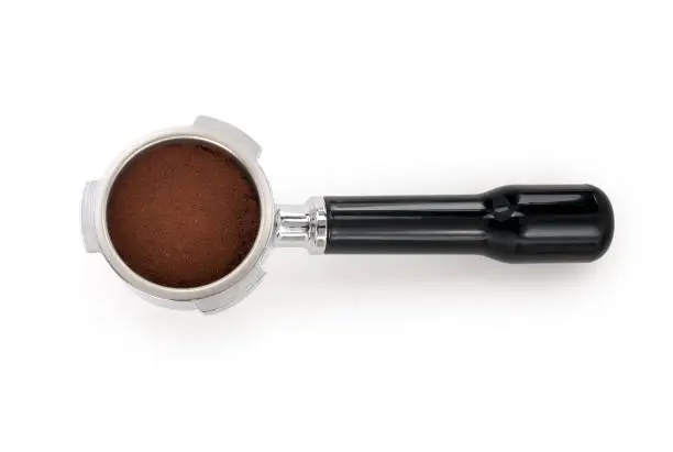 Top view of a filter holder for espresso machine isolated on white background. Contains clipping path.