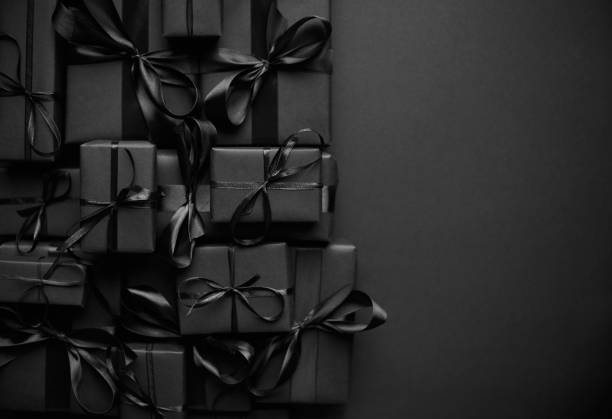 istock A pile various size black boxed gifts placed on stack. Christmas concept 1286133851