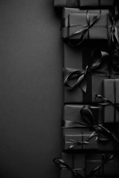 istock A pile various size black boxed gifts placed on stack. Christmas concept 1286133856