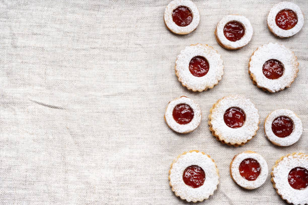 istock Homemade linzer cookies on wrinkled tablecloth. Top view 1286134941