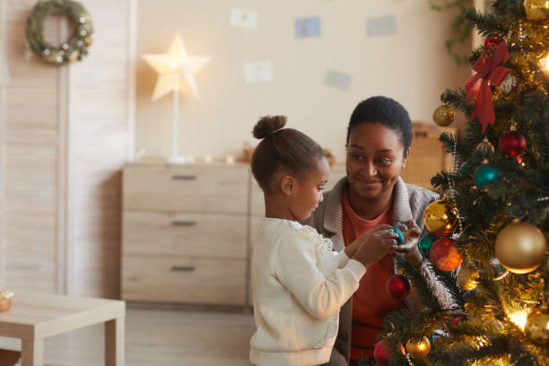 istock Little Girl Decorating Christmas Tree 1286136367