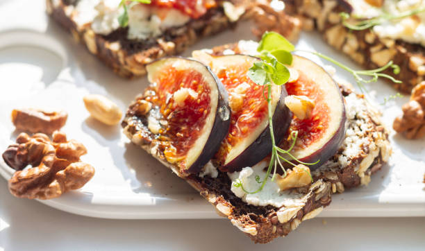 istock Fig, cheese, honey, walnut toast with hard shadow 1286138184