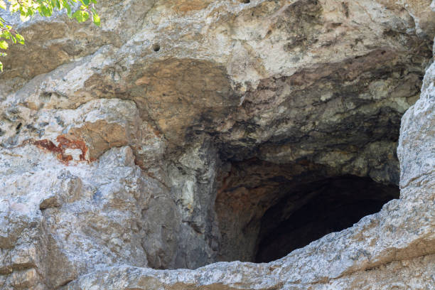 istock Ancient stone cave entrance outside view 1286138191