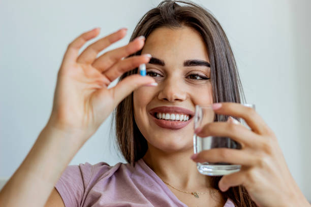 istock Young woman taking a daily medicine. 1286139098