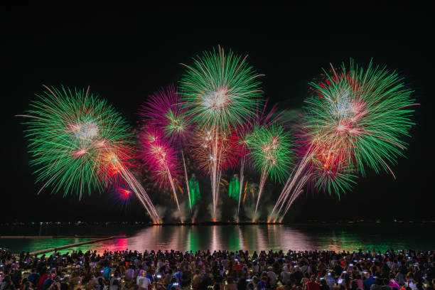istock The beautiful firework over pattaya beach with motion blur of people watching the firework.Pattaya International Firework. 1286139439