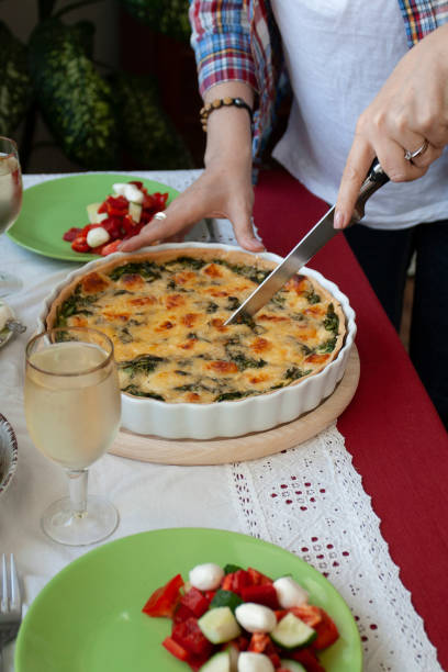 istock A gourmet lunch: spinach pie with cheese, a salad and wine. 1286139488