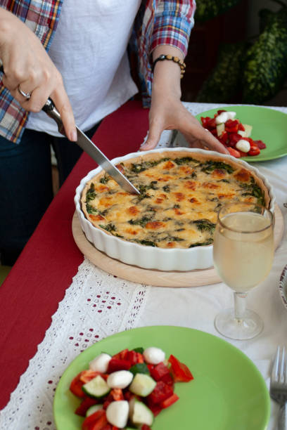 istock A gourmet lunch: spinach pie with cheese, a salad and wine. 1286141054