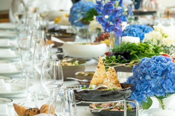 istock wedding decorations. Served wedding table with decorative fresh fresh flowers and dried flowers. celebration details. flower composition roses plates and candles in candlesticks 1286141736