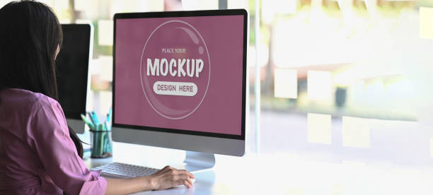 istock An attractive businesswoman working on computer in her workstation. Blank screen for graphics display montage. 1286142392