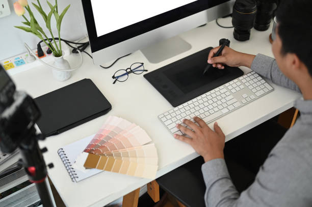 istock Cropped shot of a male graphic designer working with interactive pen display, digital drawing tablet and pen on a computer in workstation. 1286143025